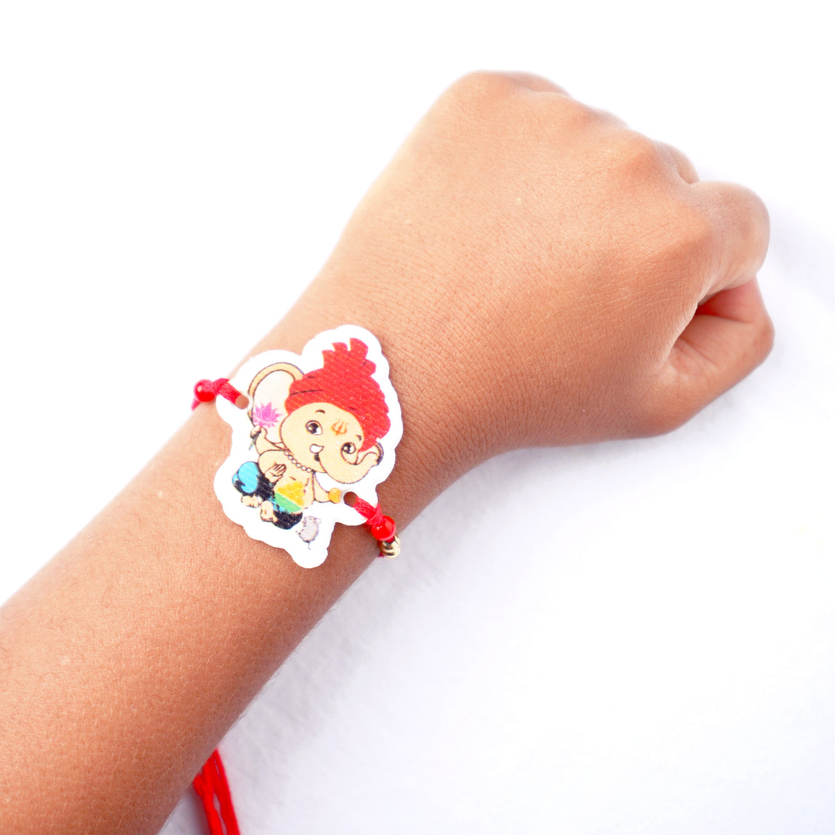 Adorable Little Ganesha Kids Rakhi with Soft Red Thread